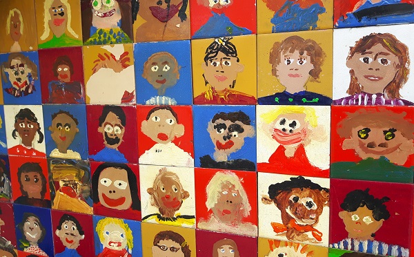 colourful children's drawings of faces